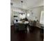 Cozy dining area features a stylish chandelier and seating for four at 1211 E Curtis St, Tampa, FL 33603