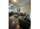 Bright living room featuring two sofas, modern decor, and a view into the dining area at 1211 E Curtis St, Tampa, FL 33603