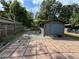 View of the backyard shed with patio area, offering extra storage space at 1211 E Curtis St, Tampa, FL 33603