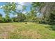 Wide open backyard space with plenty of grass at 12701 Cornell Ct, Hudson, FL 34667