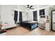 Stylized bedroom boasts wood floors, natural light, and room to personalize the space at 12701 Cornell Ct, Hudson, FL 34667