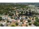 Aerial view of a single-story home nestled among other homes in a lush, landscaped neighborhood at 12815 Tallowood Dr, Riverview, FL 33579