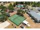 Aerial view of a community basketball court, volleyball, and other amenities for residents to enjoy at 12815 Tallowood Dr, Riverview, FL 33579