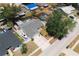 Aerial view of a well-maintained single-story home with a boat in the driveway and screened pool at 12815 Tallowood Dr, Riverview, FL 33579