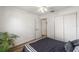Bedroom featuring a bed, wood-look tile flooring, and a double-door closet at 12815 Tallowood Dr, Riverview, FL 33579