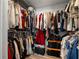 Walk-in closet featuring ample storage space at 12815 Tallowood Dr, Riverview, FL 33579