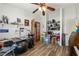 Home office space featuring wood-look tile flooring and built-in shelving at 12815 Tallowood Dr, Riverview, FL 33579
