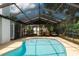 Enjoy this covered pool with ample seating for relaxing and entertaining poolside at 12815 Tallowood Dr, Riverview, FL 33579