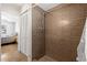 Bathroom featuring tiled walk-in shower, and tiled floors, seamlessly connected to the bedroom at 13024 124Th Ave, Largo, FL 33774
