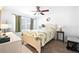 Bright bedroom with large window, tile floors and a ceiling fan to ensure comfort at 13024 124Th Ave, Largo, FL 33774