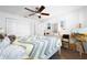 Sunlit bedroom with tile floors, ceiling fan, and ample closet space to meet your storage needs at 13024 124Th Ave, Largo, FL 33774