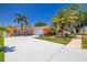 Beautifully landscaped single-Gathering home with a large driveway and a neatly kept front yard at 13024 124Th Ave, Largo, FL 33774