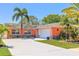 Charming single-story home with a well-manicured lawn, fresh exterior paint, and an attached garage at 13024 124Th Ave, Largo, FL 33774