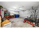 A well-lit garage space ready for your projects with an open garage door and convenient storage at 13024 124Th Ave, Largo, FL 33774