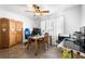 Home office with tile flooring features a ceiling fan and natural light from the bright windows at 13024 124Th Ave, Largo, FL 33774