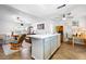 Bright, open living room with tile floors, and kitchen island featuring an eat-in breakfast bar at 13024 124Th Ave, Largo, FL 33774