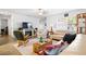 Comfortable living room featuring tile flooring, neutral furniture, and a fireplace, creating a cozy atmosphere at 13024 124Th Ave, Largo, FL 33774