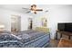 Spacious main bedroom featuring tile floors, an ensuite bathroom and a large window at 13024 124Th Ave, Largo, FL 33774