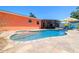 Enjoy the sparkling pool with tanning ledge surrounded by a brick paver patio and a privacy fence at 13024 124Th Ave, Largo, FL 33774