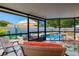 View from screened patio features a private in-ground swimming pool and ample lounging space at 13024 124Th Ave, Largo, FL 33774