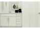 Clean bathroom vanity with marble countertops and white cabinetry at 13186 Goldstone Ct, Wimauma, FL 33598