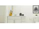 Bright bathroom with a stylish vanity, decorative accents, and modern fixtures at 13186 Goldstone Ct, Wimauma, FL 33598
