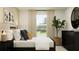 Calm bedroom featuring a comfortable bed, a dresser, and ample natural light at 13186 Goldstone Ct, Wimauma, FL 33598