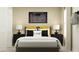 Inviting bedroom featuring a cozy bed, nightstands, and modern decor for a peaceful retreat at 13186 Goldstone Ct, Wimauma, FL 33598