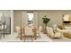 Cozy dining area features a modern table with seating for six, and natural light at 13186 Goldstone Ct, Wimauma, FL 33598
