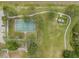 Aerial view of community basketball court, playground and picnic area with tables and benches at 13610 S Village Dr # 4212, Tampa, FL 33618
