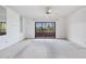 Bright bedroom with carpet, ceiling fan, and sliding glass door to patio at 13610 S Village Dr # 4212, Tampa, FL 33618