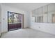 Bright bedroom with a sliding glass door that leads to a balcony with great lighting and ample closet space at 13610 S Village Dr # 4212, Tampa, FL 33618