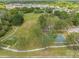 Aerial view of community park with playground, basketball court, fitness area and walking path at 13610 S Village Dr # 4212, Tampa, FL 33618