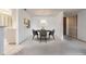 Dining room with seating for four, carpet, and artwork at 13610 S Village Dr # 4212, Tampa, FL 33618