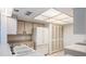 Well-lit kitchen with white cabinets, appliances, and tiled floors, offering practicality at 13610 S Village Dr # 4212, Tampa, FL 33618