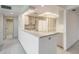 Well-lit kitchen offering a breakfast bar and open layout at 13610 S Village Dr # 4212, Tampa, FL 33618