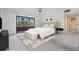 Serene bedroom with balcony access and a comfortable bed with soft lighting at 13610 S Village Dr # 4212, Tampa, FL 33618