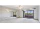 Spacious main bedroom has a mirrored wall and sliding glass doors leading to the outside at 13610 S Village Dr # 4212, Tampa, FL 33618