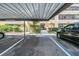 Assigned covered parking spot in front of the building entrance with accessible parking in a quiet community at 13610 S Village Dr # 4212, Tampa, FL 33618