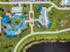 Aerial view of the colorful community playground, offering a fun and safe area for children to play at 13610 S Village Dr # 4212, Tampa, FL 33618