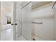 Shower with sliding glass door and grab bar at 13610 S Village Dr # 4212, Tampa, FL 33618