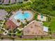 This aerial view showcases a community pool, a playground, and a basketball court at 13622 Tonya Anne Dr, Riverview, FL 33579