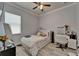 This bedroom boasts clean lines, a window with natural light, and modern fixtures and decor throughout at 13622 Tonya Anne Dr, Riverview, FL 33579