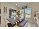 Cozy dining nook with seating for six offers a view of the water and lots of light at 13622 Tonya Anne Dr, Riverview, FL 33579