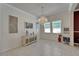 Bright dining room with chandelier, neutral decor, lots of light and plenty of space for entertaining at 13622 Tonya Anne Dr, Riverview, FL 33579