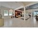 Open-concept living area features tile floors, modern lighting and stylish decor with plentiful natural light at 13622 Tonya Anne Dr, Riverview, FL 33579