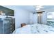 Bedroom featuring sliding closet doors, a ceiling fan, and a dresser with television at 13870 Oakwood Ln # 13870, Seminole, FL 33776
