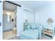 Bedroom featuring chair, sliding closet, vanity, and ensuite bathroom at 13870 Oakwood Ln # 13870, Seminole, FL 33776