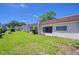 Inviting one story exterior shows manicured lawn and a glimpse of neighboring homes at 13870 Oakwood Ln # 13870, Seminole, FL 33776