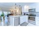 Bright, updated kitchen with granite counters, stainless appliances, open to dining area at 13870 Oakwood Ln # 13870, Seminole, FL 33776